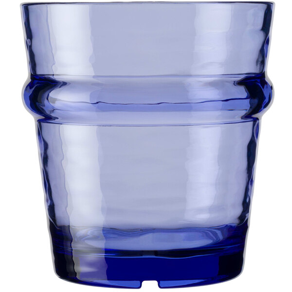 A stackable Libbey Tidal Blue Tritan plastic rocks glass with a blue rim.