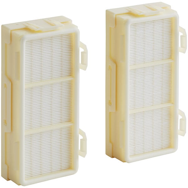 Two white Dyson HEPA filters for an Airblade V hand dryer.