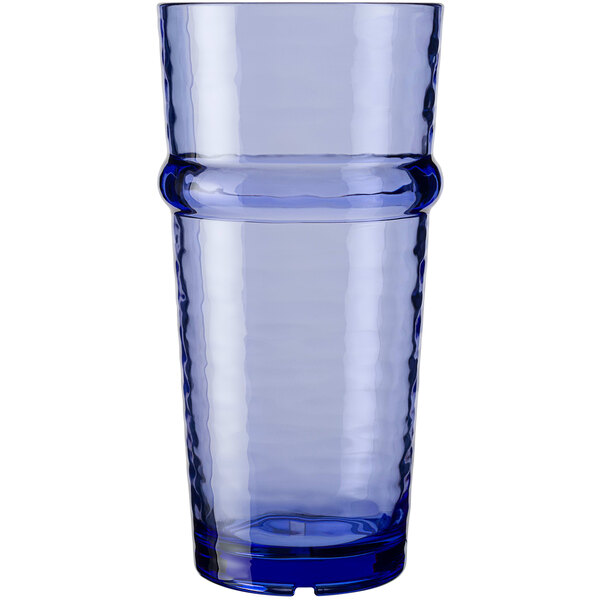 A close-up of a Libbey Tidal Blue plastic cooler glass with a curved rim.