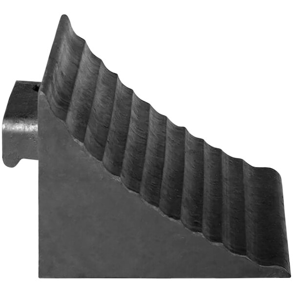 A black molded rubber wheel chock with a metal handle.