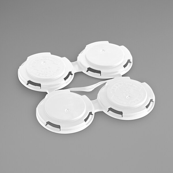 A white plastic PakTech container with four round caps.