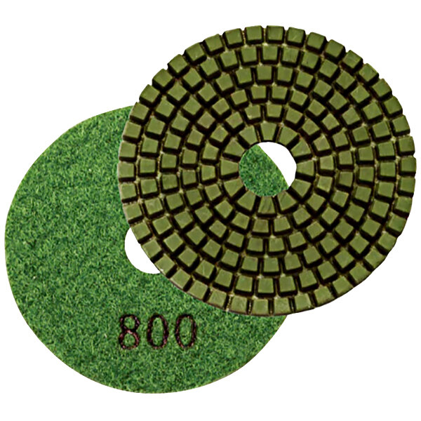 A close-up of two green Onfloor High-Speed Resin Diamond Pads with the number 800.
