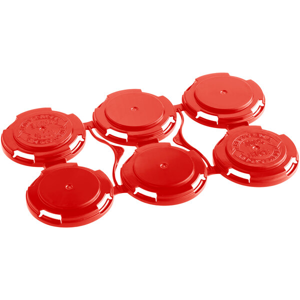 A red plastic PakTech can carrier with six circles.