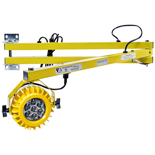 A yellow Ideal Warehouse heavy-duty LED dock light fixture with a round light.