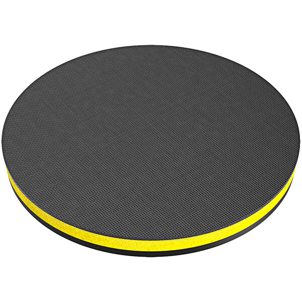 A black and yellow circular Onfloor hook and loop pad driver with a yellow stripe.