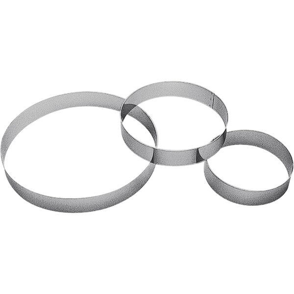 Three Gobel stainless steel metal custard rings.