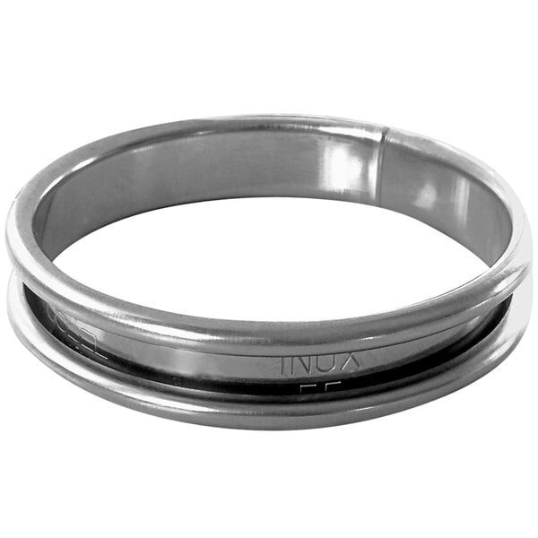 A close-up of a Gobel stainless steel round cookie ring.