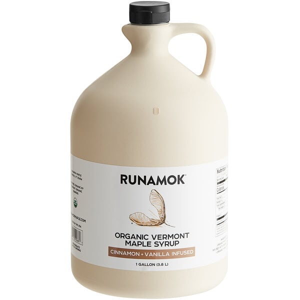 A jug of Runamok Cinnamon and Vanilla-Infused Maple Syrup with a label.