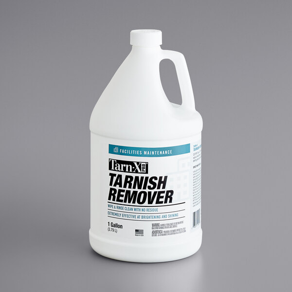 A white bottle of Tarn-X tarnish remover with a handle.