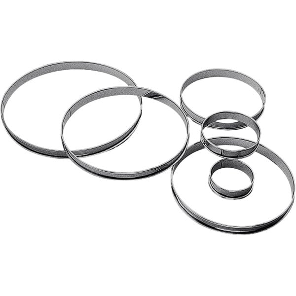 A group of Gobel stainless steel circular tart rings.