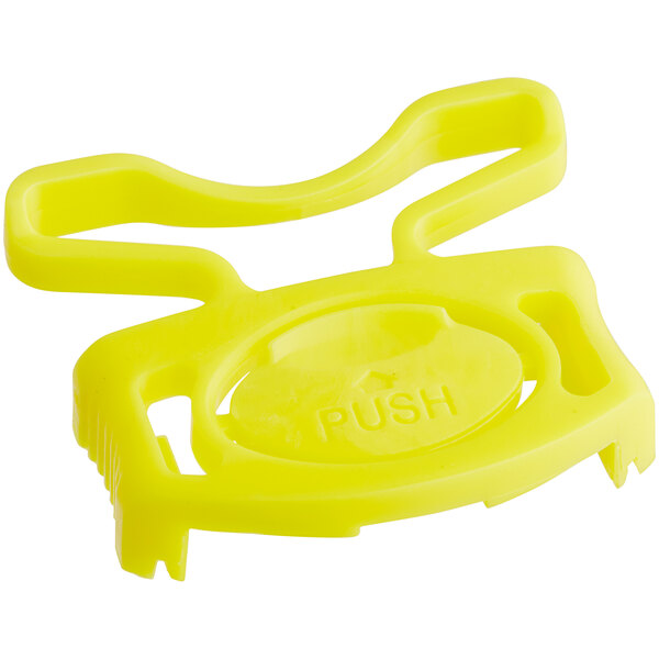 A yellow plastic Avantco controller clip with a push button.