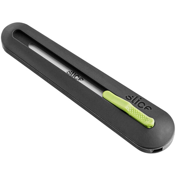 A black and green Slice Auto-Retractable Industrial Knife on a counter.