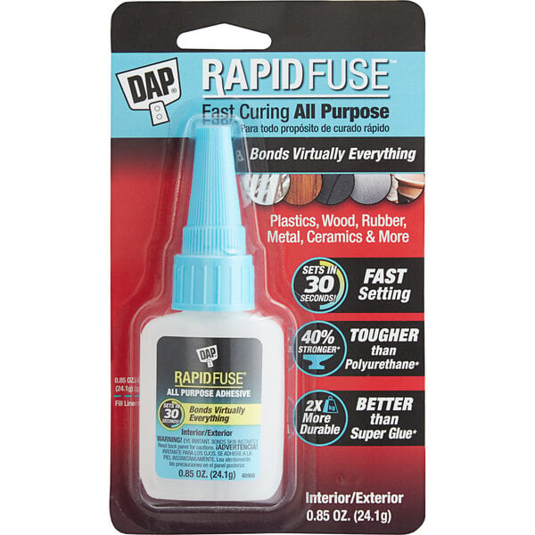A white package containing a DAP RapidFuse .85 oz. clear all purpose adhesive bottle with a blue cap.