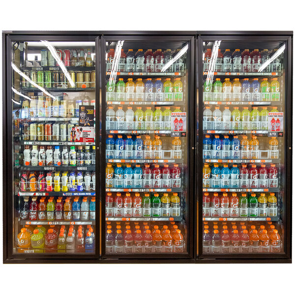 A Styleline walk-in cooler merchandiser door with shelving open to display a variety of drinks.