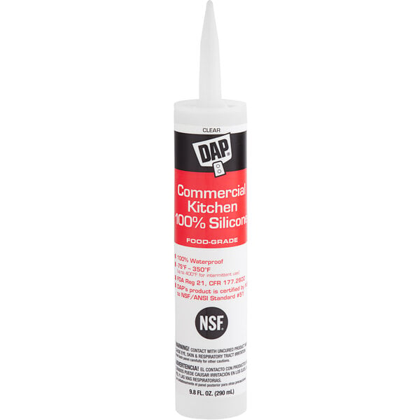 A white tube of DAP Clear Commercial Kitchen Silicone Sealant with a white label.