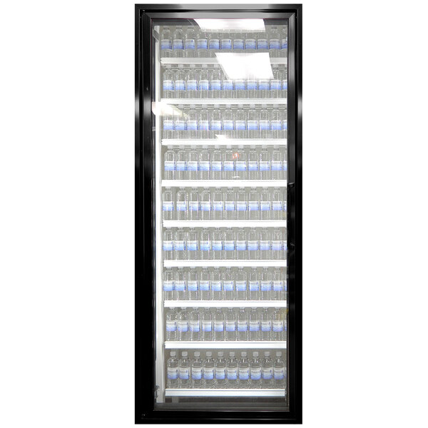 A white glass Styleline walk-in cooler door with shelving holding water bottles.