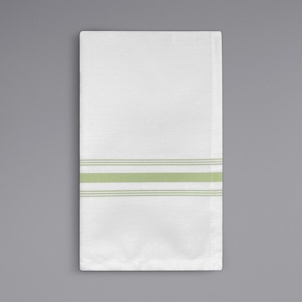 A close-up of a white napkin with green stripes.