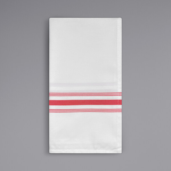 A white cloth napkin with red stripes.