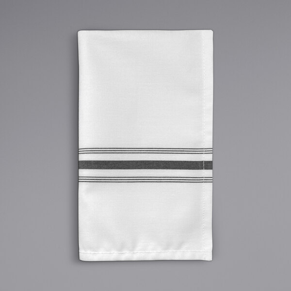 A white napkin with black stripes.
