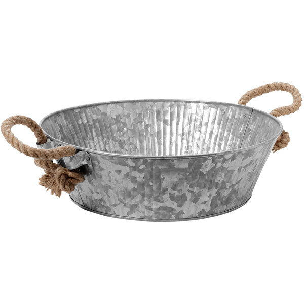 A stainless steel round tray with rope handles.