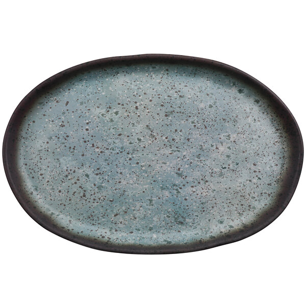 A close up of a robin's egg blue oval cheforward melamine plate with speckles.