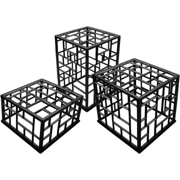 A black metal cube riser set with geometric designs.