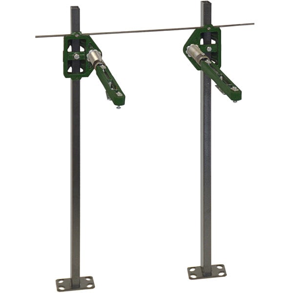 A pair of green metal brackets with green handles and metal poles.