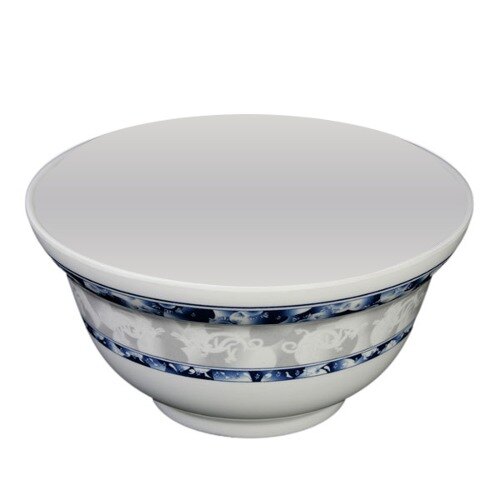 A white melamine noodle bowl with blue dragon designs on the rim.