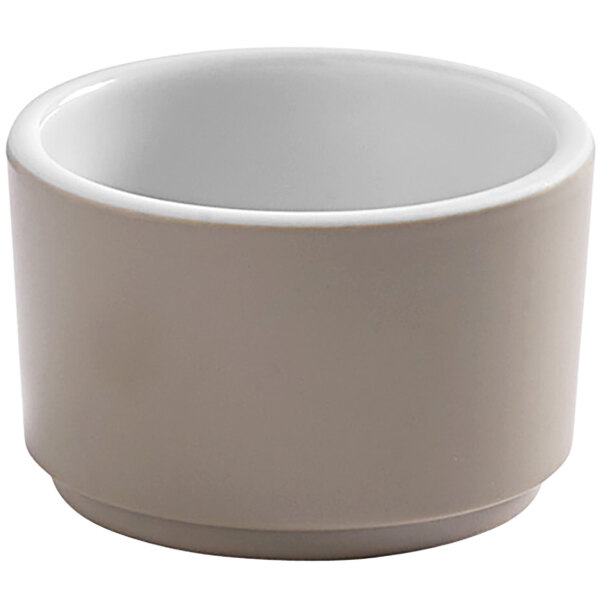 An American Metalcraft white melamine sauce cup with a handle.