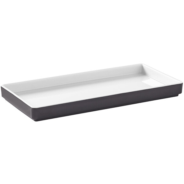 A white rectangular tray with a black design.
