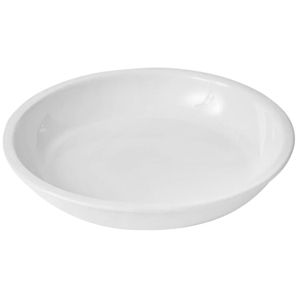 A white porcelain insert for a saute pan.