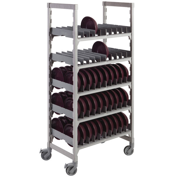 A Cambro Camshelving dome drying rack with plates on it.