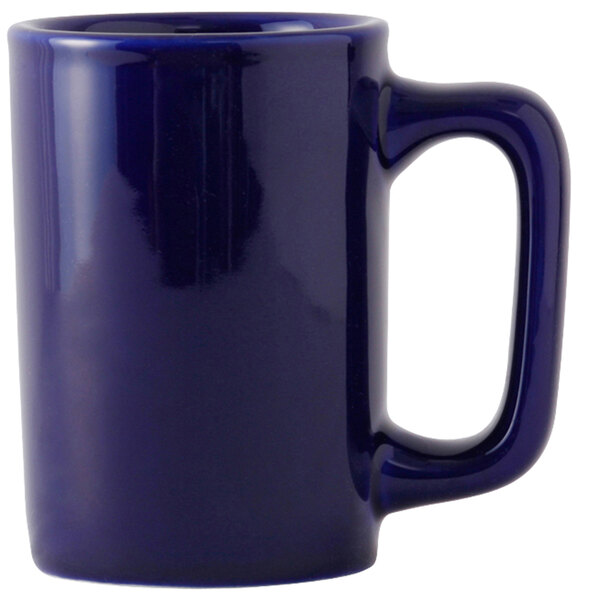 A blue Tuxton china mug with a handle.