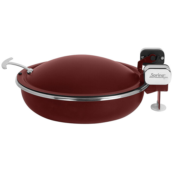 A red round stainless steel chafer with a lid with chrome accents.