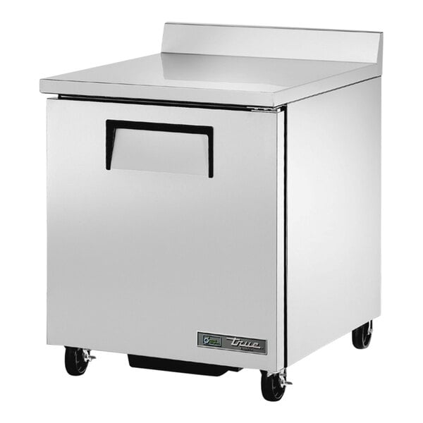 A silver True worktop freezer with a black handle.