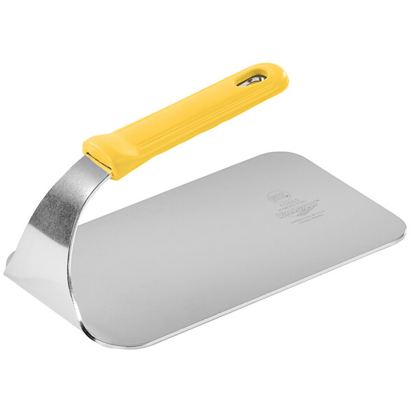 A silver rectangular Vollrath steak weight with a yellow handle.
