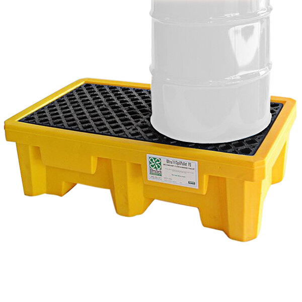 A yellow Vestil spill pallet with white drums on top.