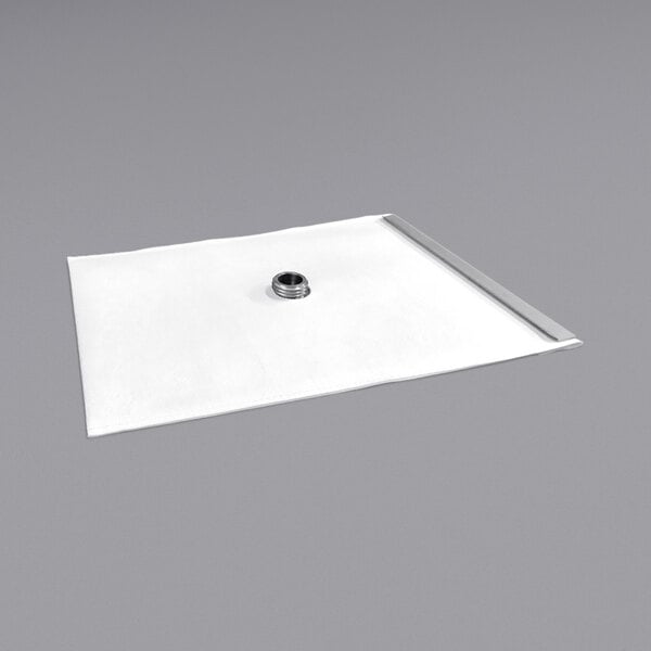 A white square reusable filter paper with a metal nut on it.