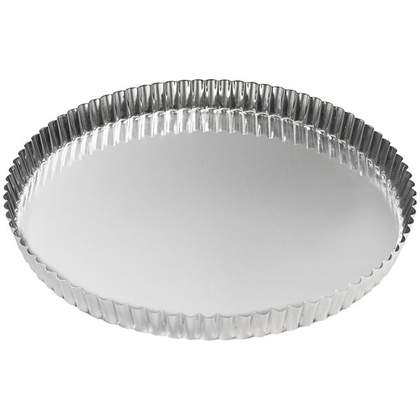 A silver round fluted tart pan.