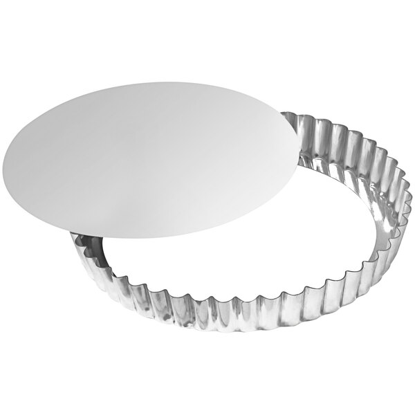 A round silver Gobel tart and quiche pan with a removable bottom.