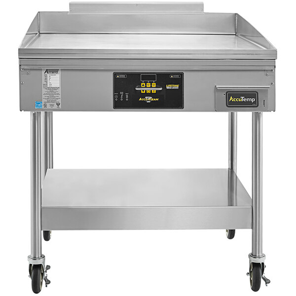 An AccuTemp stainless steel commercial gas griddle on a stand with casters.