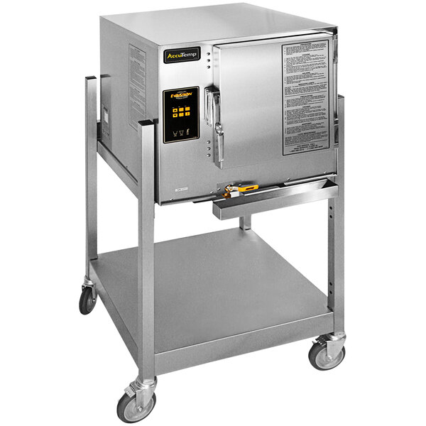 A large metal AccuTemp Evolution stand-mounted electric steamer with a door on wheels.