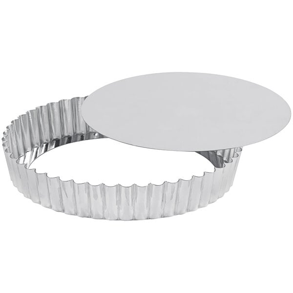 A silver Gobel round fluted tart pan with a removable bottom.