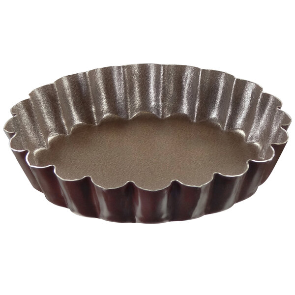 A Gobel round fluted tartlet pan with a white background.