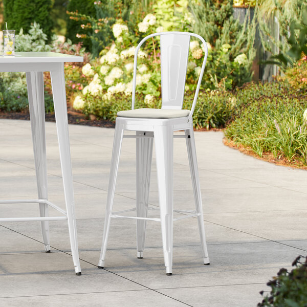 Lancaster Table & Seating Alloy Series White Outdoor Cafe Barstool with Tan Fabric Magnetic Cushion