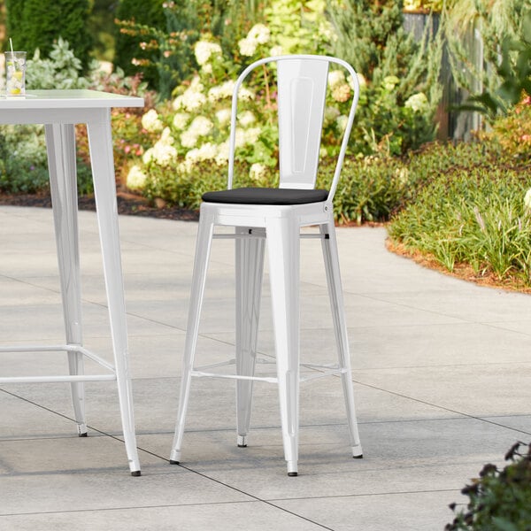 Lancaster Table & Seating Alloy Series White Outdoor Cafe Barstool with Black Fabric Magnetic Cushion