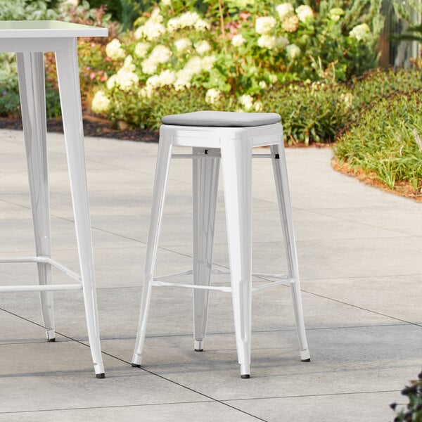 Lancaster Table & Seating Alloy Series White Outdoor Backless Barstool with Gray Fabric Magnetic Cushion