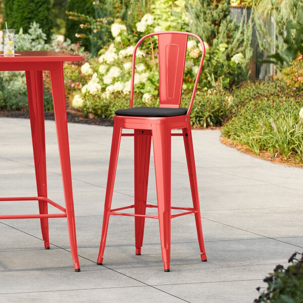 Lancaster Table & Seating Alloy Series Ruby Red Outdoor Cafe Barstool with Black Fabric Magnetic Cushion