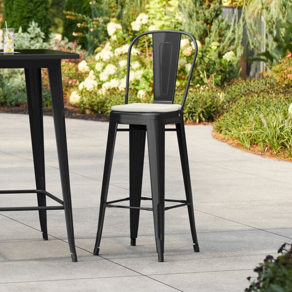 Lancaster Table & Seating Alloy Series Black Outdoor Cafe Barstool with Tan Fabric Magnetic Cushion