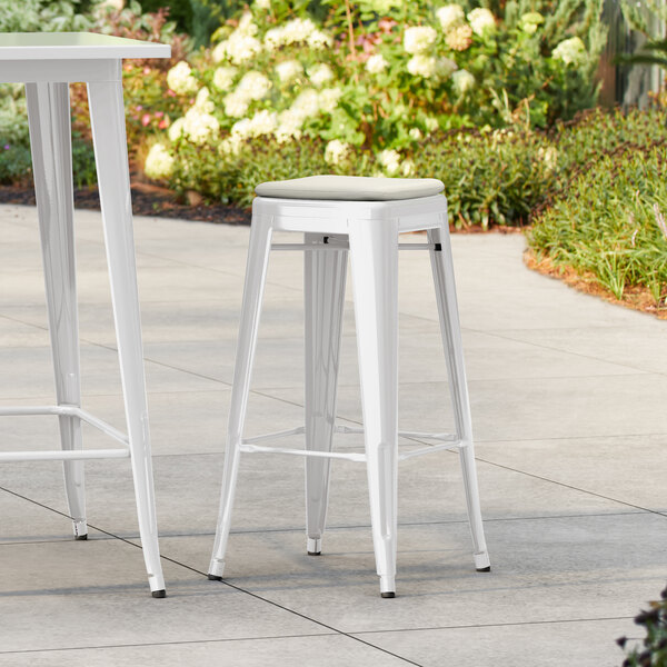 Lancaster Table & Seating Alloy Series White Outdoor Backless Barstool with Tan Fabric Magnetic Cushion